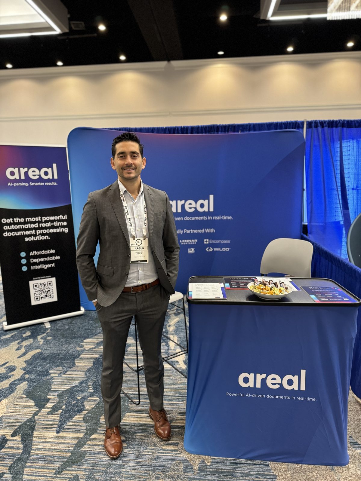 Areal team with customers at a conference